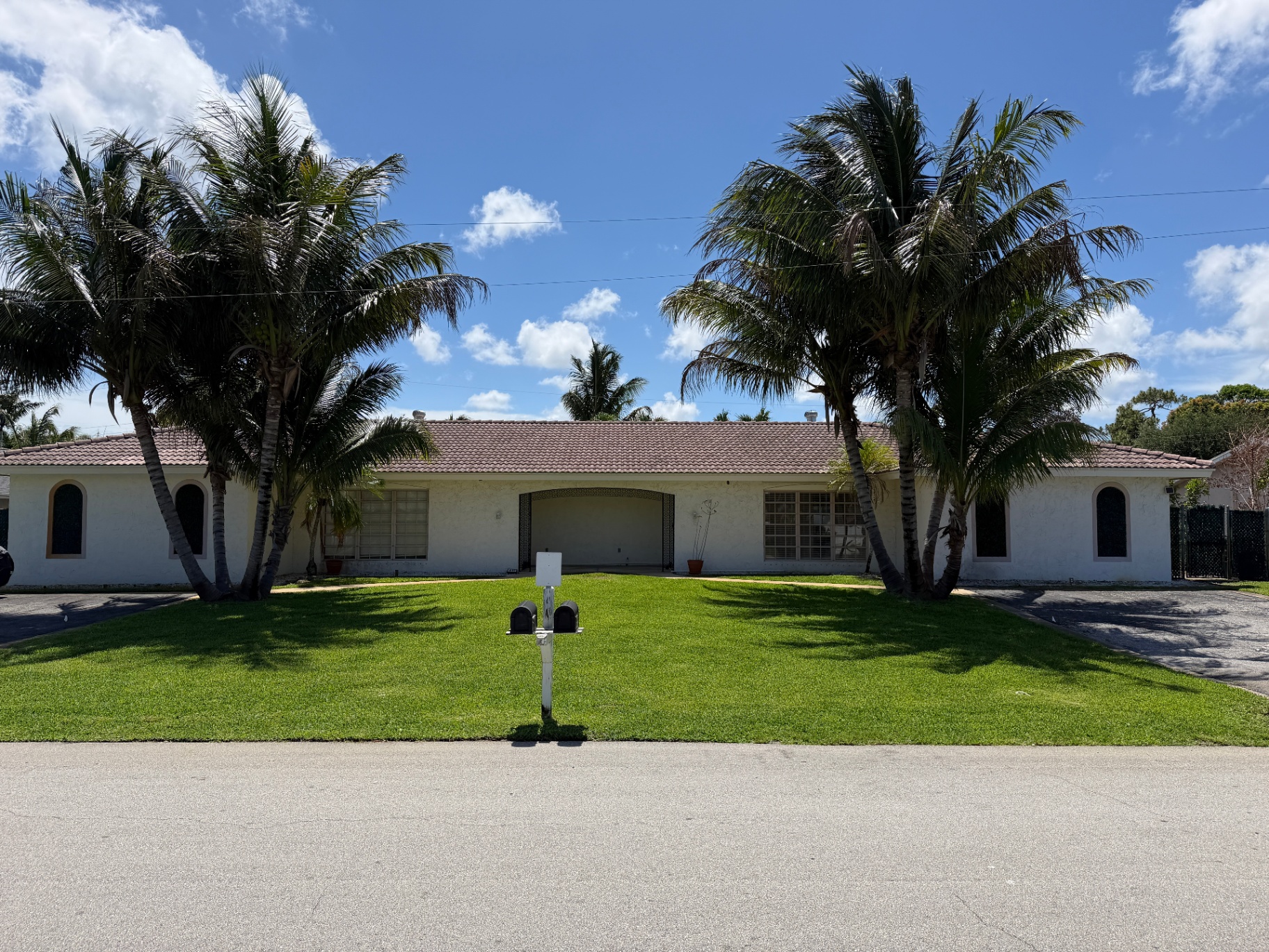 499 W Conference Drive front exterior with palms